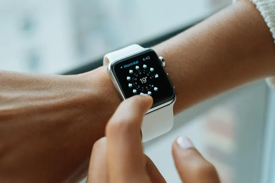 A smartwatch on a wrist, one of many devices that quietly sets its clock over the internet