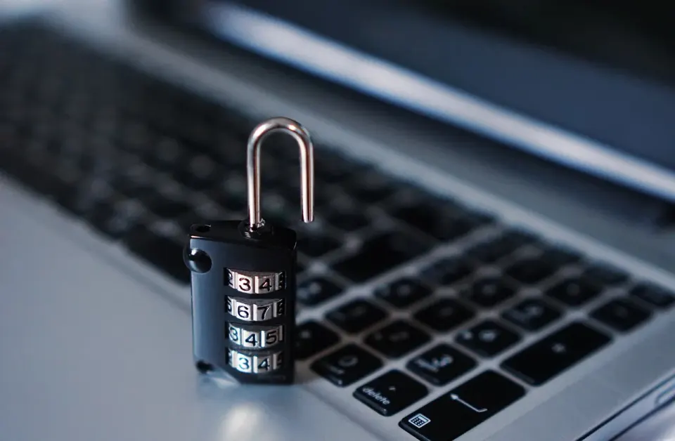 A padlock resting on a computer keyboard, a symbol of the privacy settings readers can turn on