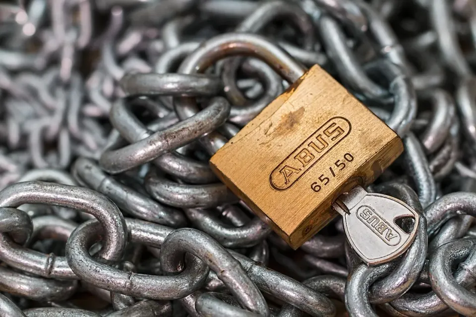 A padlock and key on a chain, a simple picture of a key pair locking an account