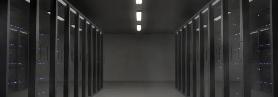 Rows of servers in a dark server room, the kind of machines that hand out network time