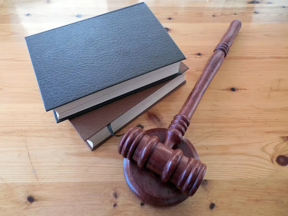 A judge's gavel resting on a stack of law books